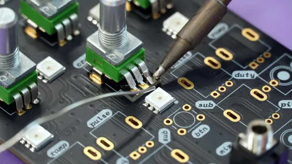 Manual soldering of PCB board during electronics assembly process