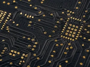 High frequency PCB material detail with fine RF routing, plated vias, ENIG pads, and laminate edge texture