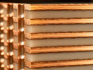 High-frequency PCB material cross-section showing controlled dielectric substrate layers and copper interface for RF signal stability.
