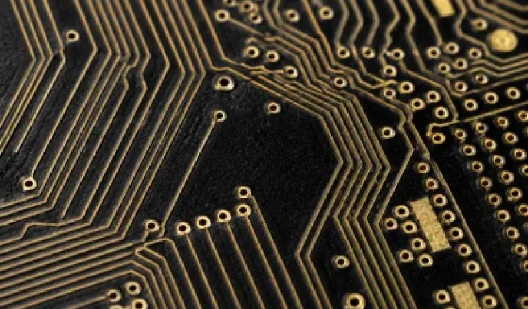 Prototype PCB detail with fine routing traces and ENIG surface finish